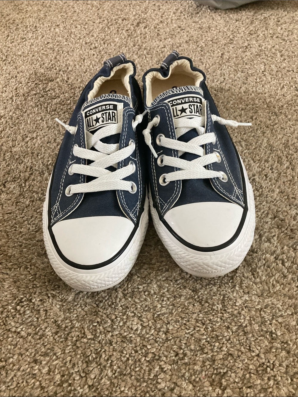 Converse women’s Low Top slip on Sneakers in Navy and White